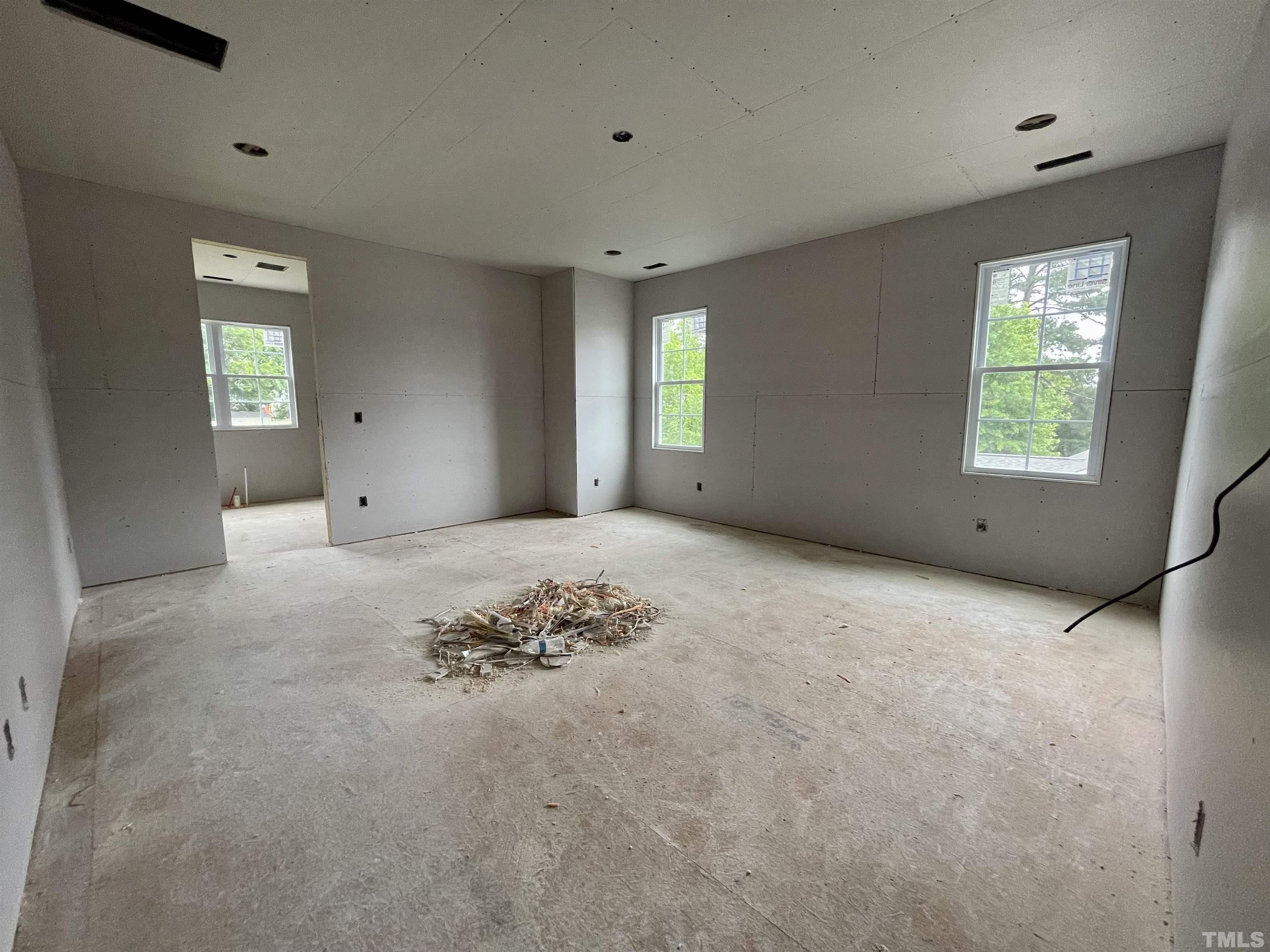 301 Georgetown Road Raleigh, NC 27608 - Photo 37 of 77 a view of a big room with windows and chandelier fan