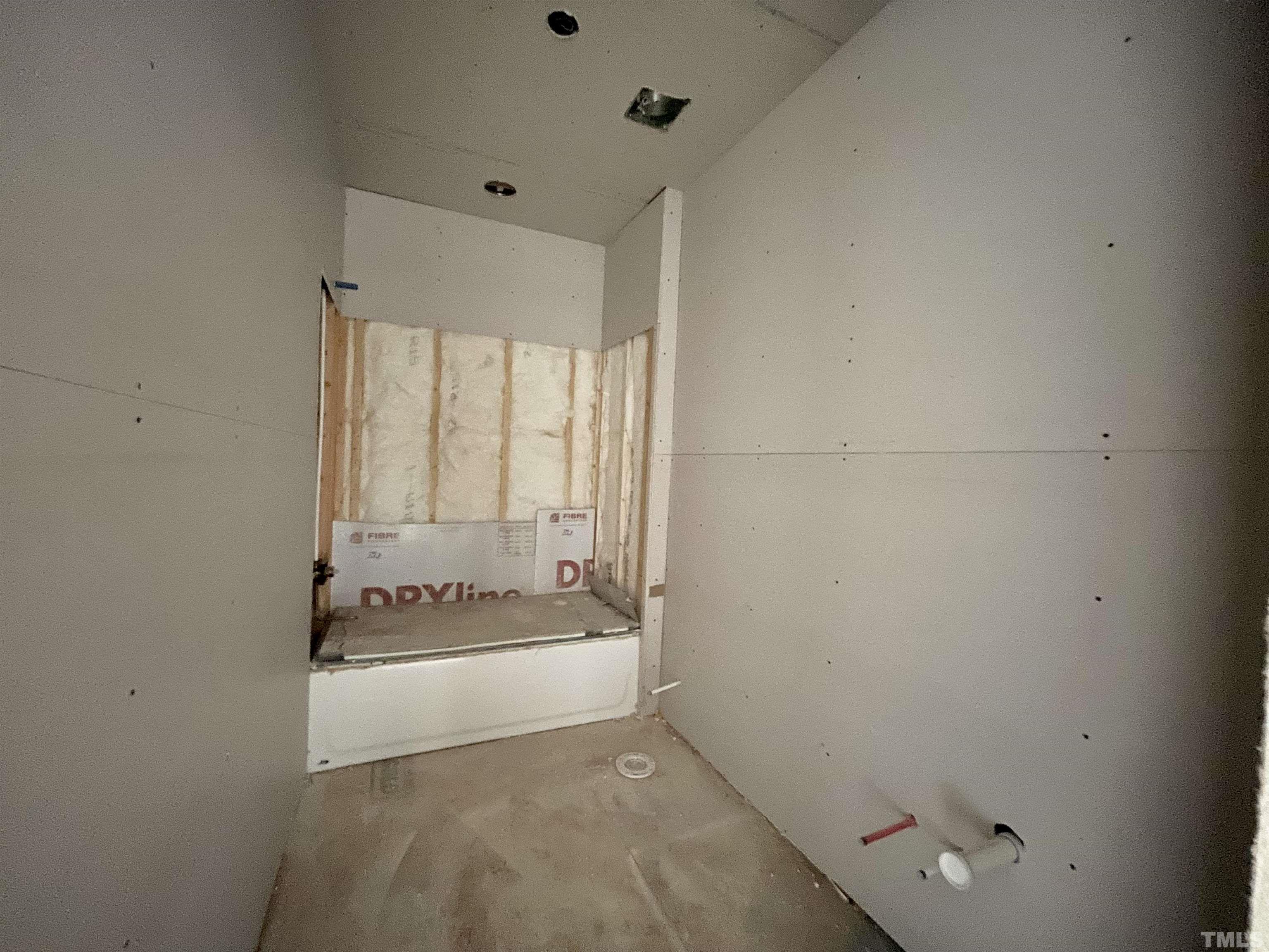 301 Georgetown Road Raleigh, NC 27608 - Photo 46 of 77 a bathroom with a bathtub and a window