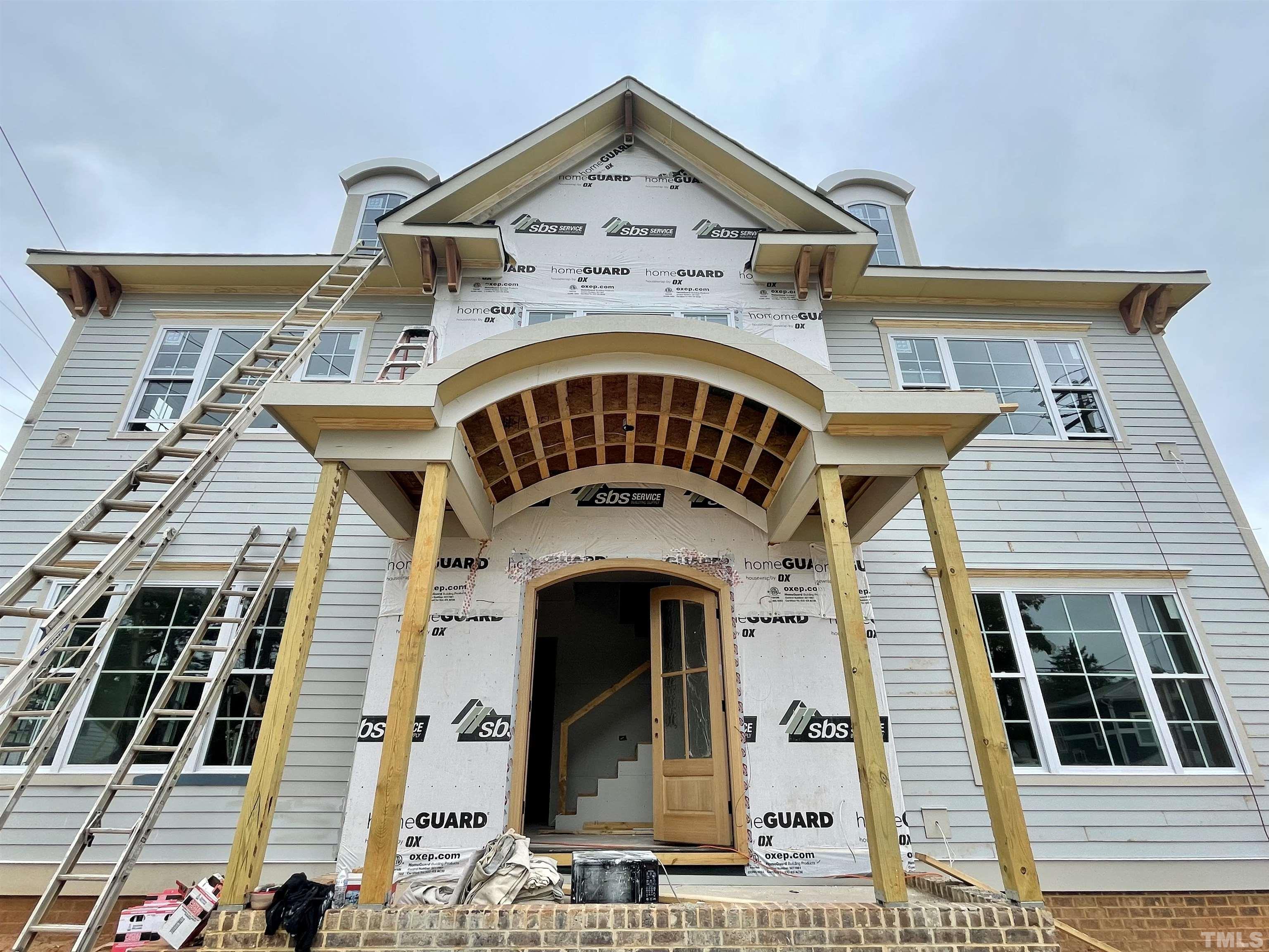 301 Georgetown Road Raleigh, NC 27608 - Photo 61 of 77 a large building with a clock on the top