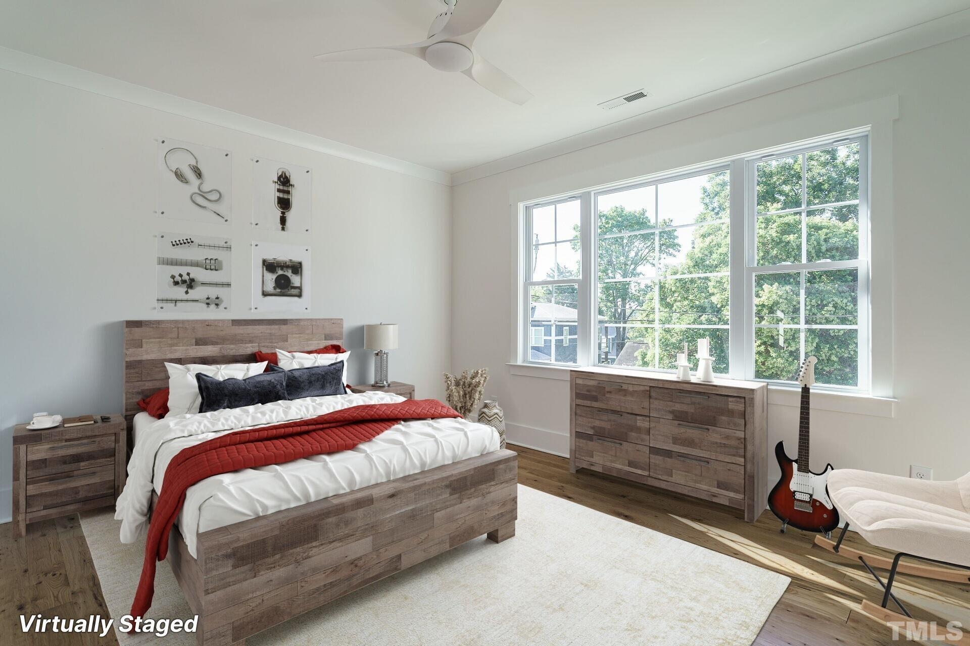 301 Georgetown Road Raleigh, NC 27608 - Photo 68 of 77 a bedroom with a bed and a window