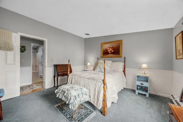 a bed room with a bed and a tv