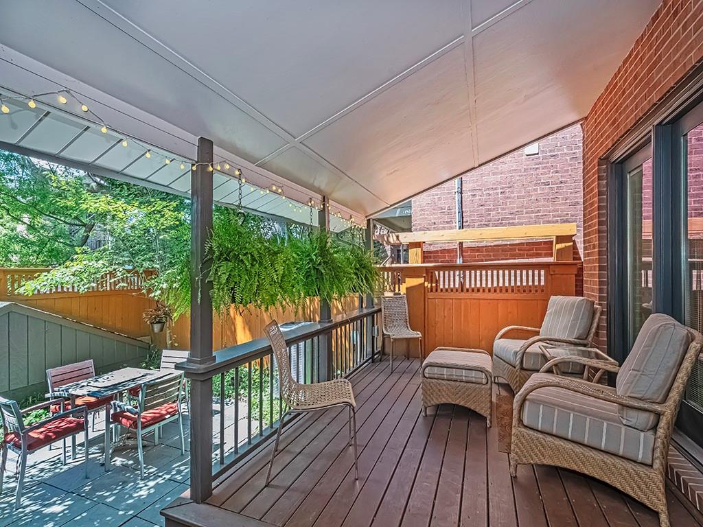 718 Filbert Street Pittsburgh, PA 15232 - Photo 25 of 28 Step outside to your private oasis with a covered deck and patio, perfect for relaxing mornings or lively gatherings.
