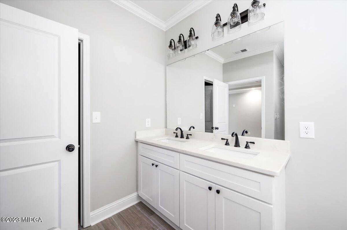 255 High Ridge Court Macon, GA 31220 - Photo 18 of 28 a bathroom with a double vanity sink mirror and