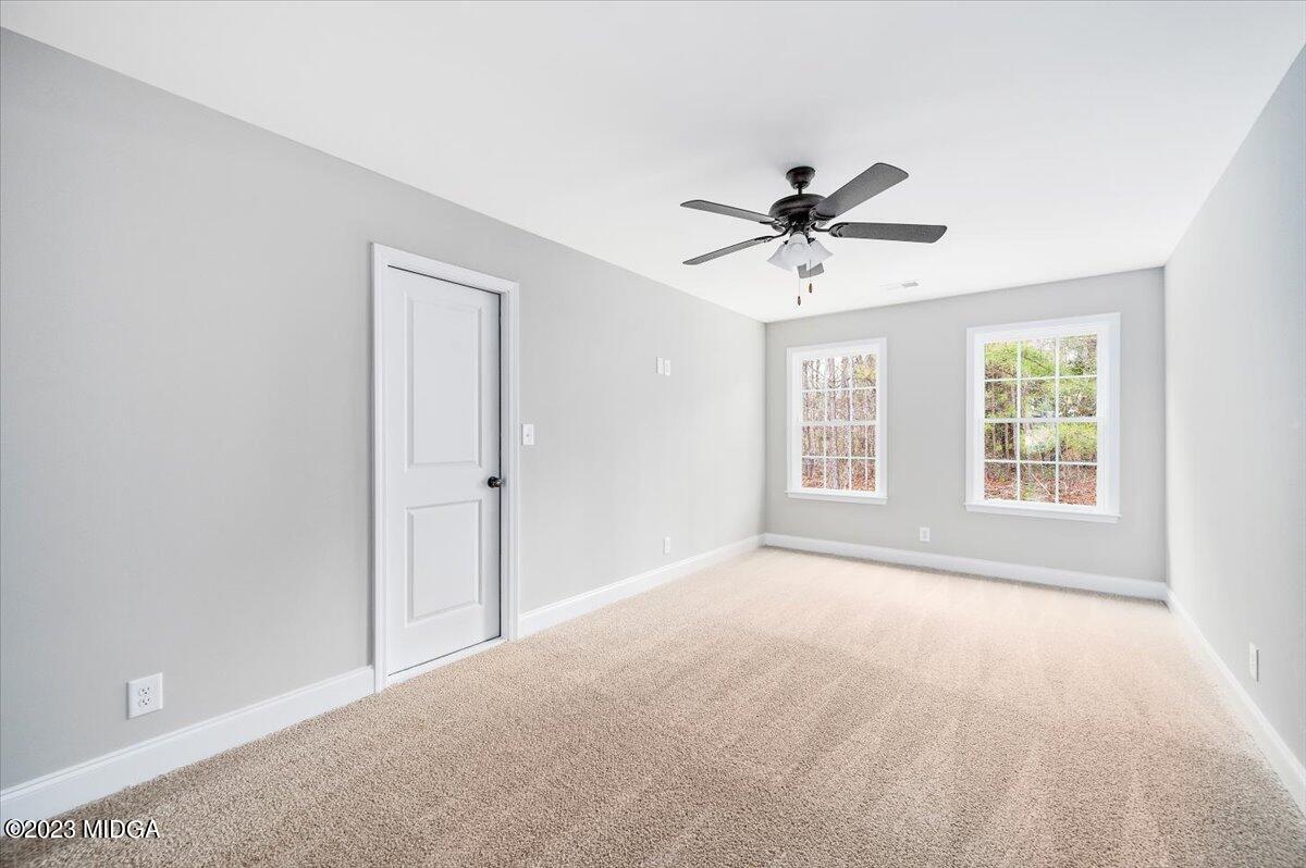 255 High Ridge Court Macon, GA 31220 - Photo 22 of 28 a view of a room with a ceiling fan and a window