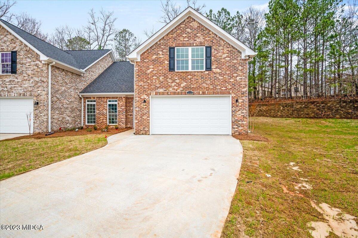 255 High Ridge Court Macon, GA 31220 - Photo 26 of 28 a front view of a house with a yard and garage
