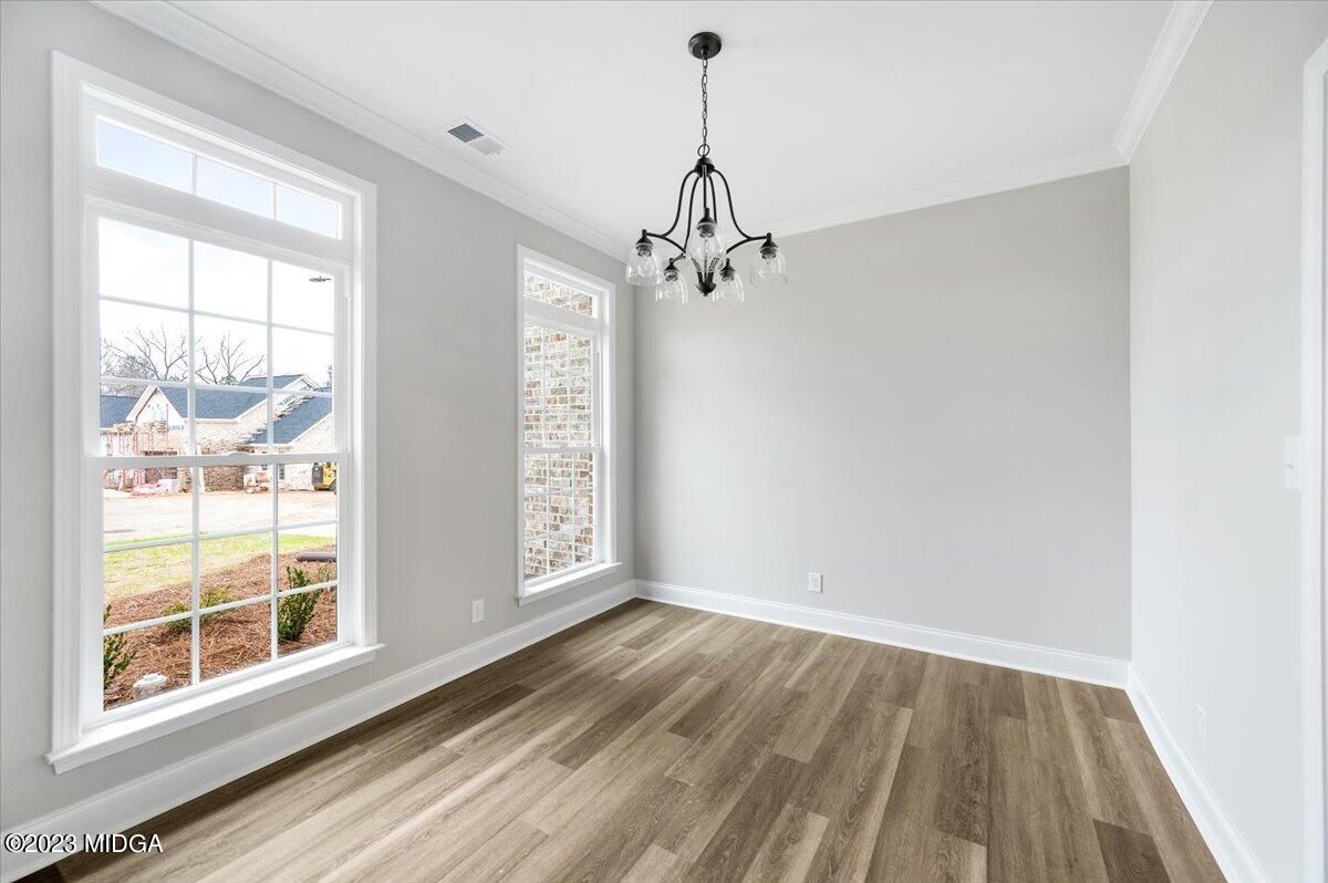 255 High Ridge Court Macon, GA 31220 - Photo 3 of 28 a view of empty room with wooden floor and fan