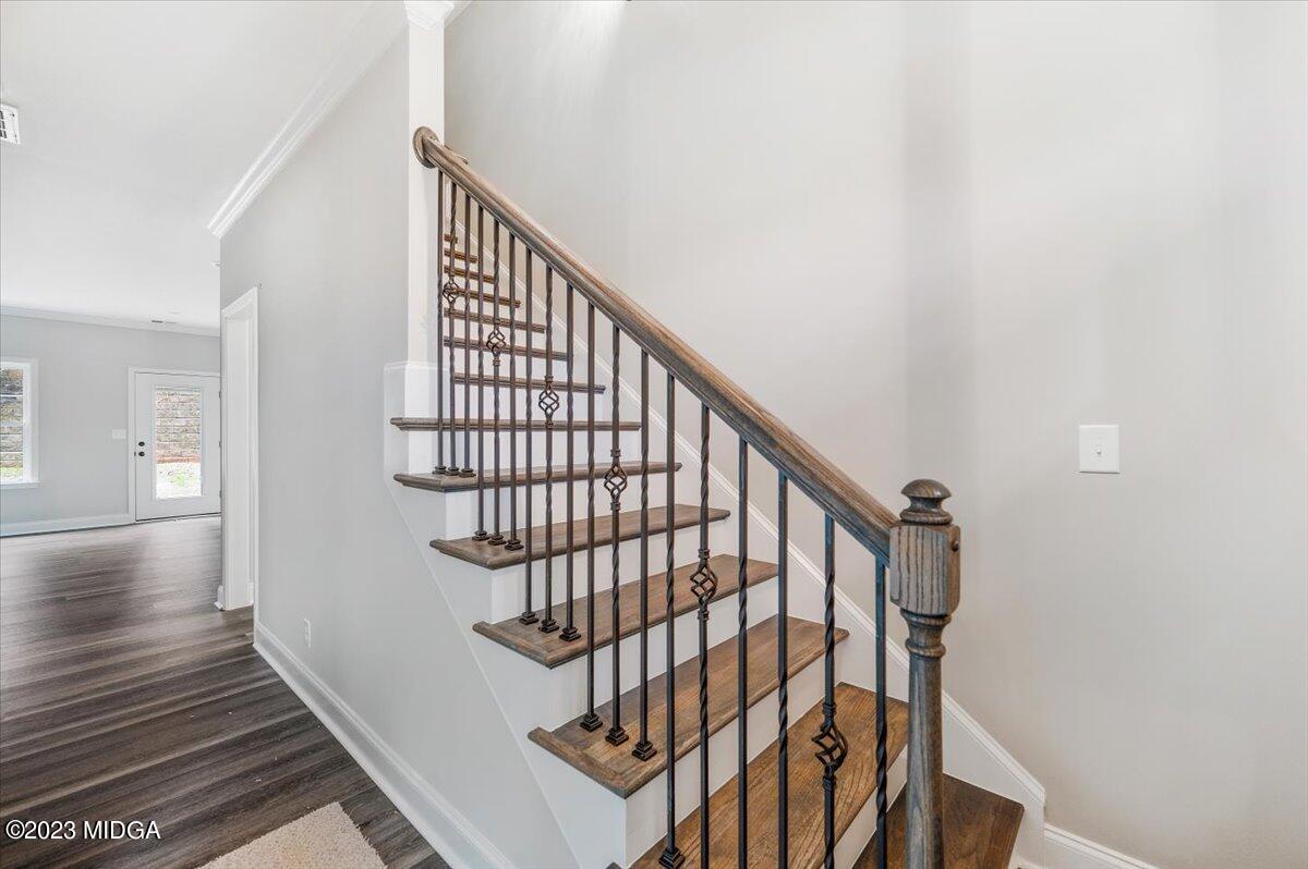255 High Ridge Court Macon, GA 31220 - Photo 5 of 28 a view of staircase with wooden floor and white walls