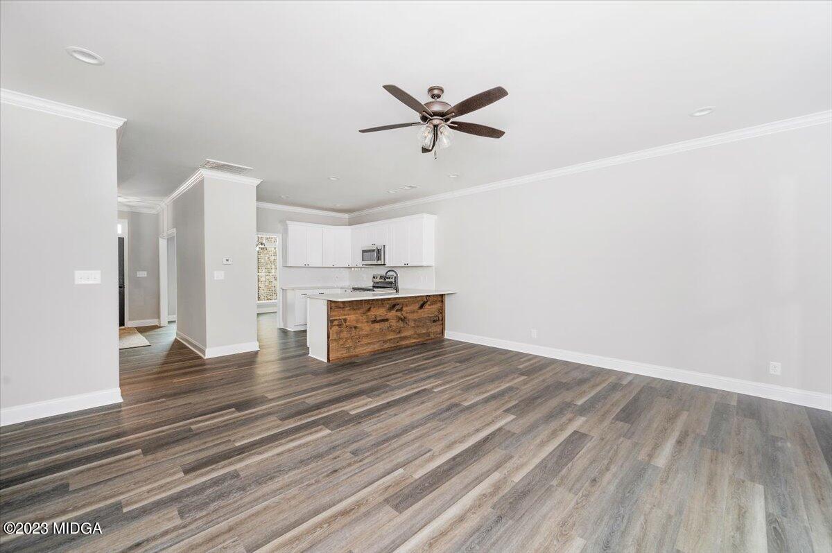 255 High Ridge Court Macon, GA 31220 - Photo 8 of 28 a view of a livingroom with wooden floor and a ceiling fan