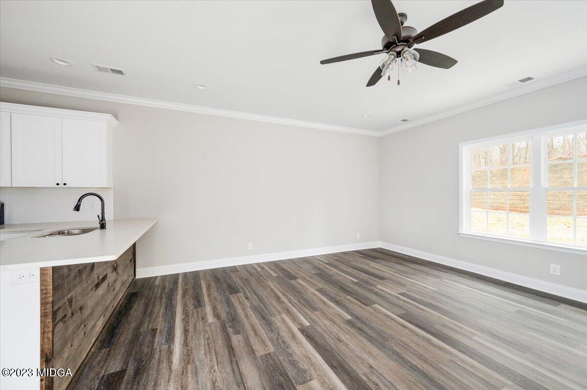 255 High Ridge Court Macon, GA 31220 - Photo 9 of 28 wooden floor in an empty room with a window
