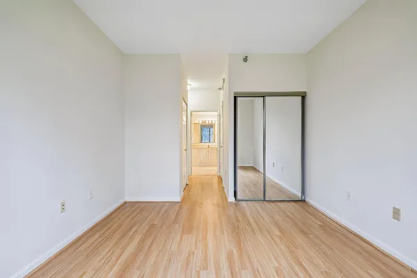 a view of hallway with wooden floor