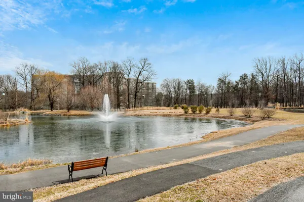 a view of a patio with table and chairs under an umbrella