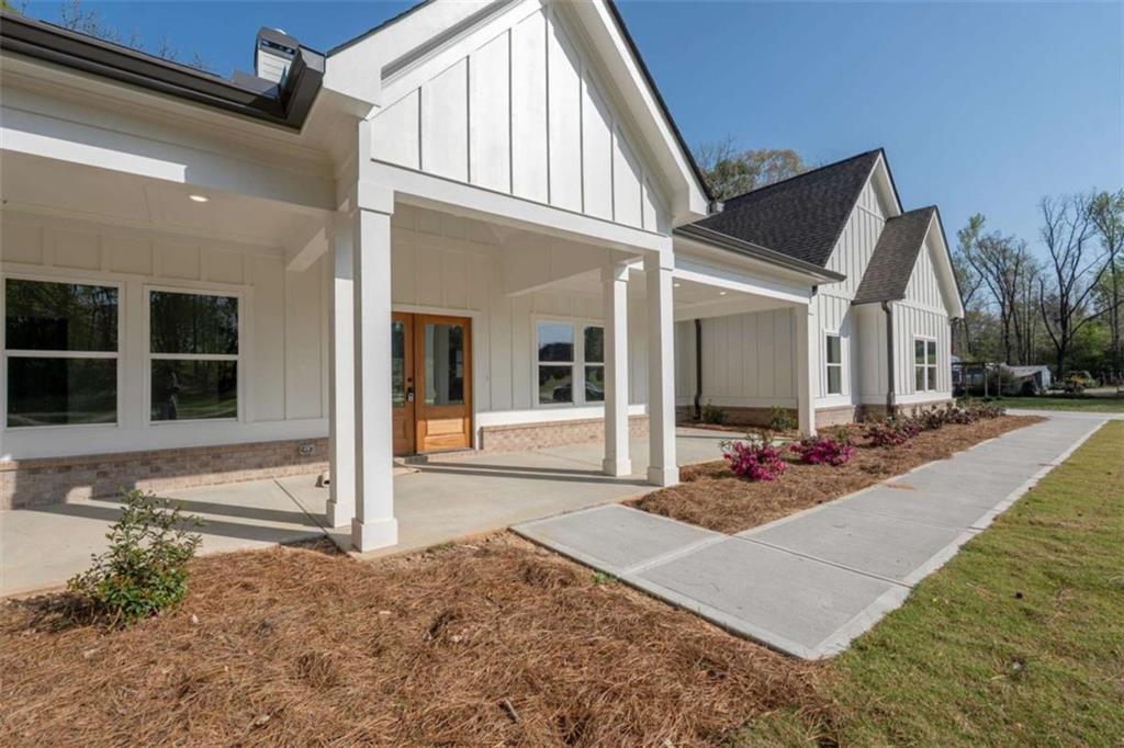 11691 Hazelbrand Road Northeast Covington, GA 30014 - Photo 2 of 53 a view of a house with porch