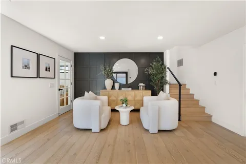 a bedroom with a bed and large window