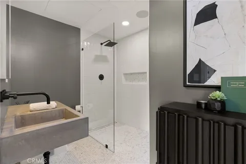 a bedroom with a large bed and a couch