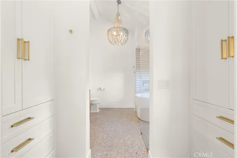 a bedroom with a bed and a lamp