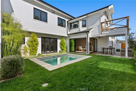 a kitchen with stainless steel appliances kitchen island a sink and cabinets