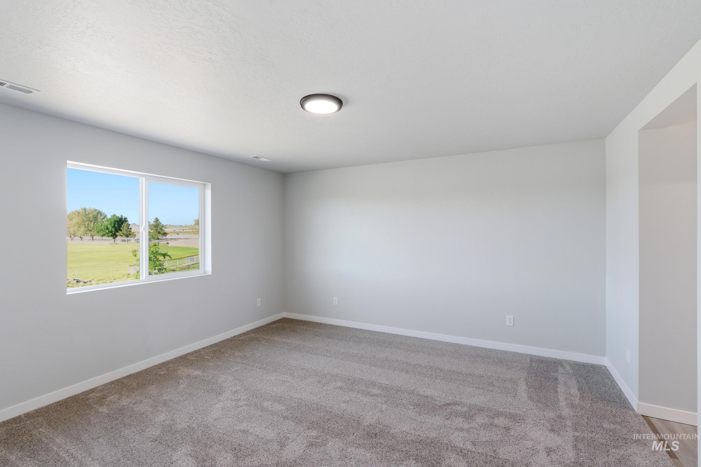 13709 Redway Court Caldwell, ID 83607 - Photo 27 of 28 Carpeted room with a large window