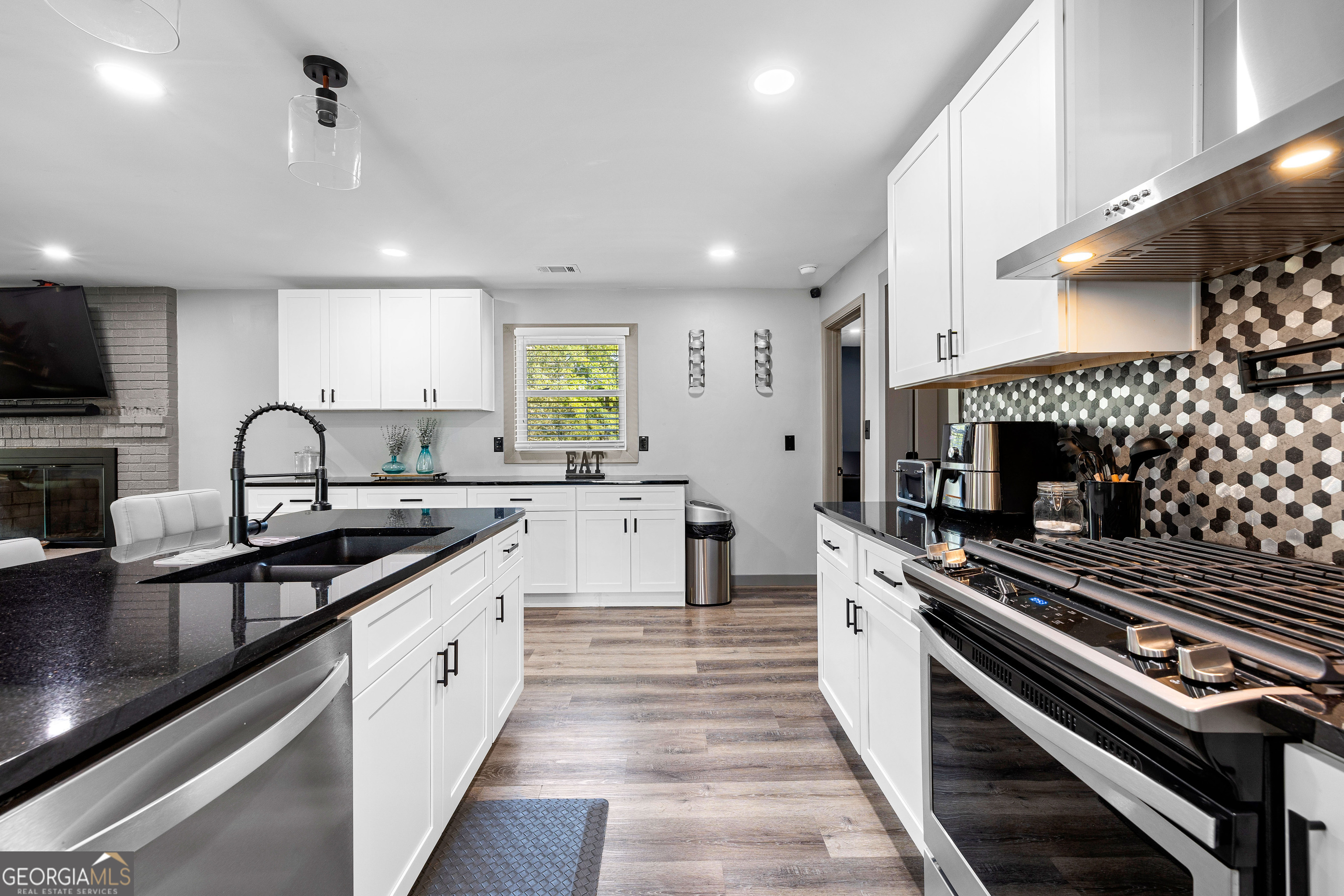 105 Ransby Drive Hogansville, GA 30230 - Photo 12 of 52 a large kitchen with a stove and a sink