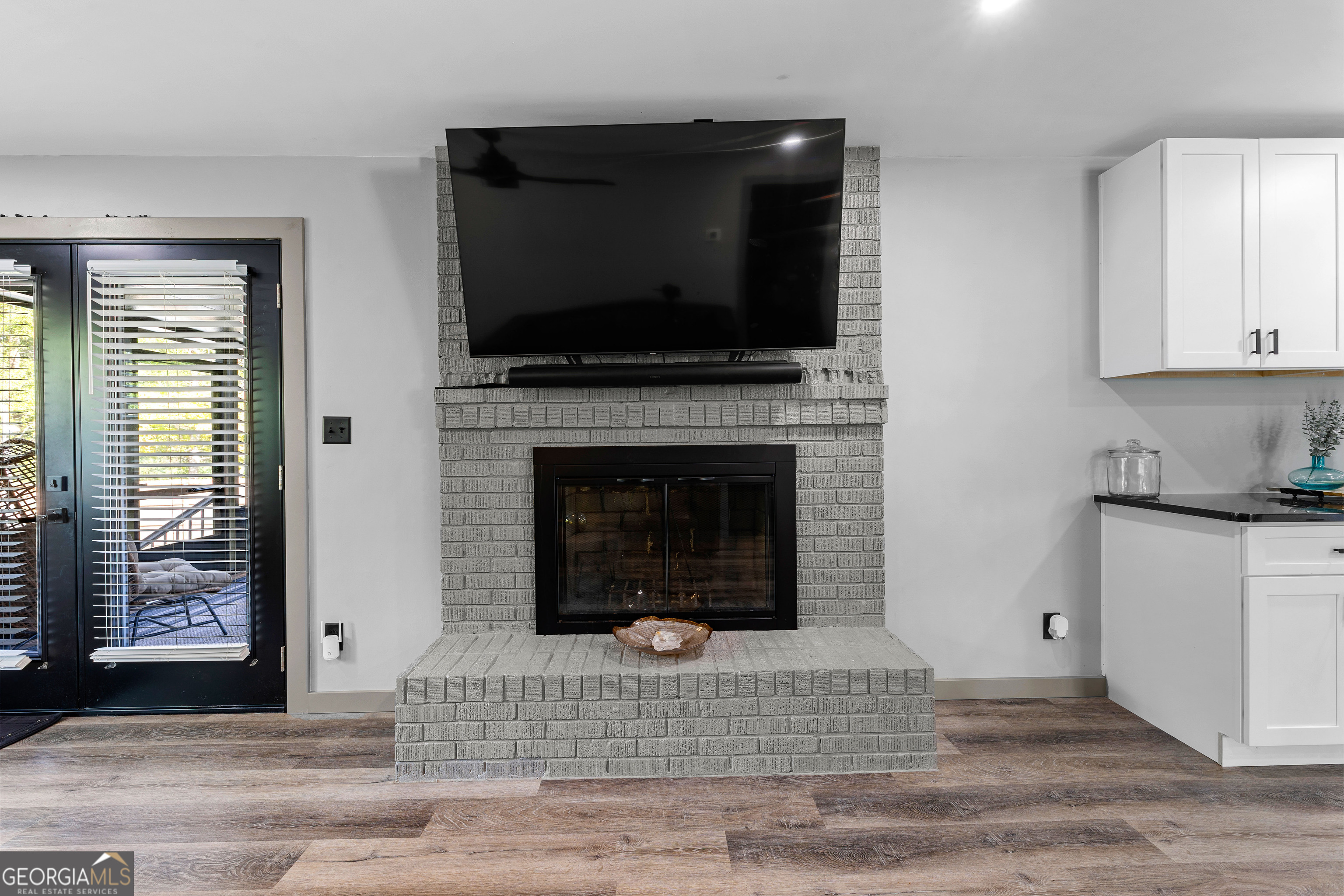 105 Ransby Drive Hogansville, GA 30230 - Photo 14 of 52 a living room with a fireplace and a flat screen tv