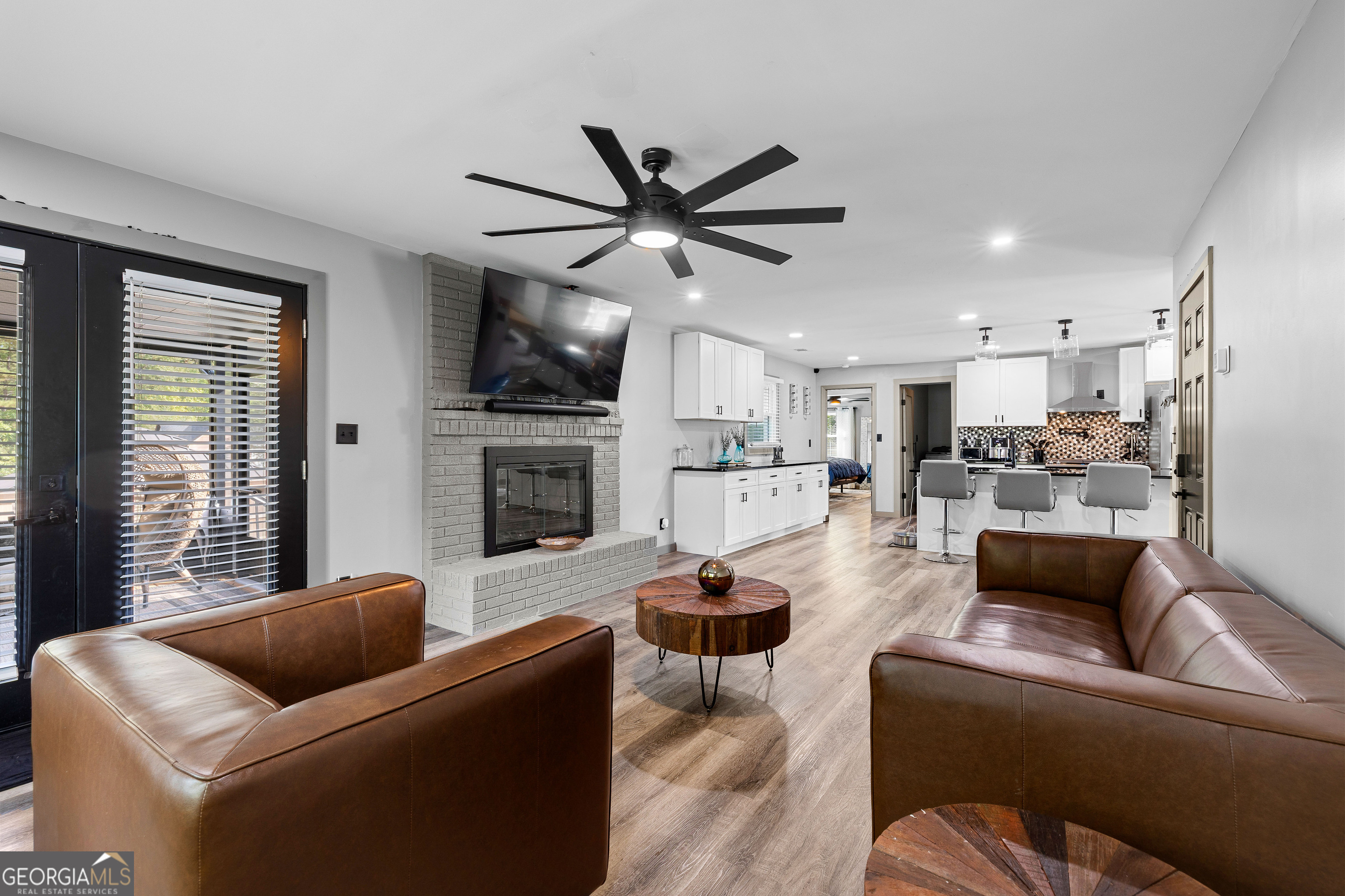 105 Ransby Drive Hogansville, GA 30230 - Photo 15 of 52 a living room with furniture kitchen view and a fireplace