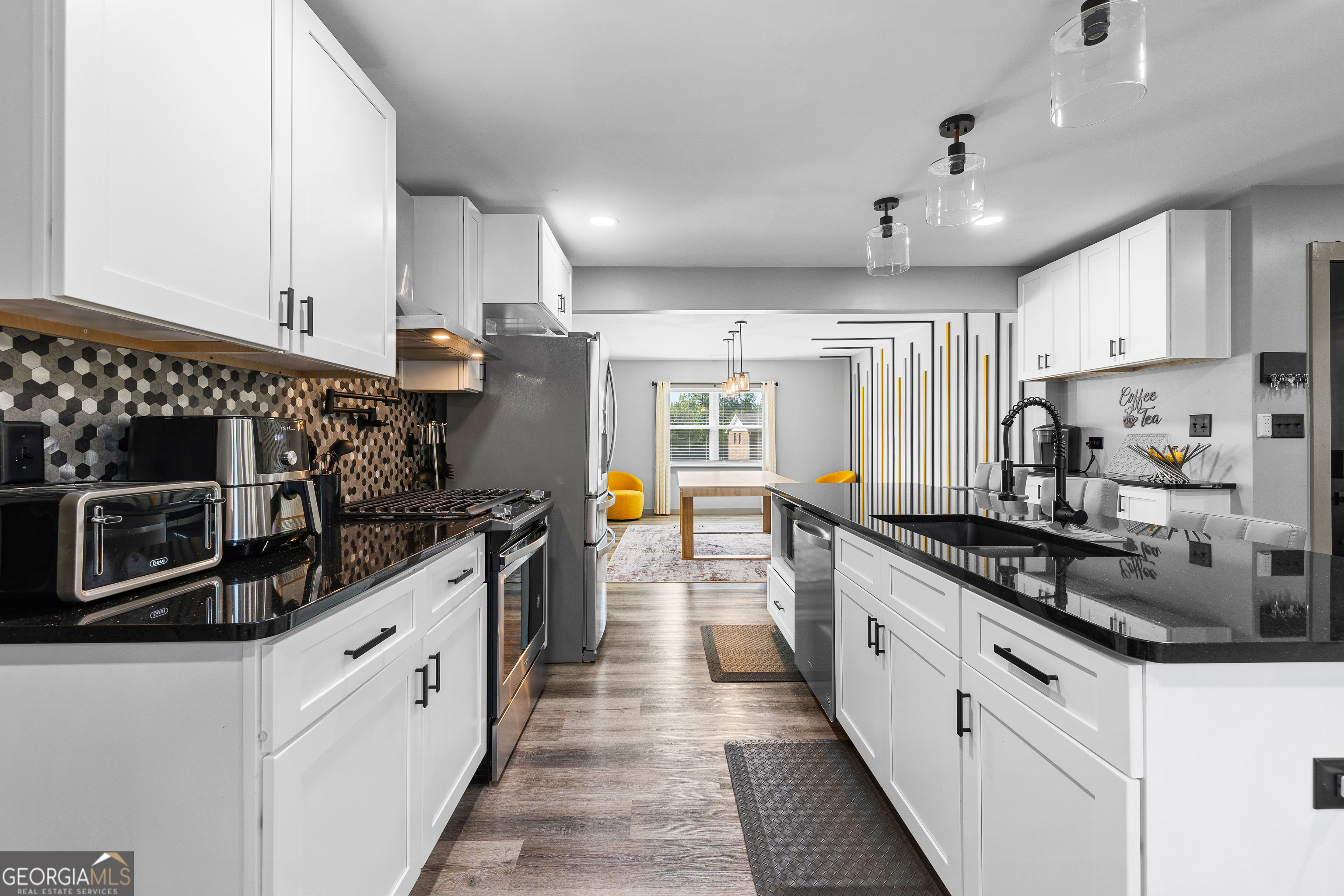 105 Ransby Drive Hogansville, GA 30230 - Photo 17 of 52 a large kitchen with stainless steel appliances granite countertop a lot of counter space and a sink