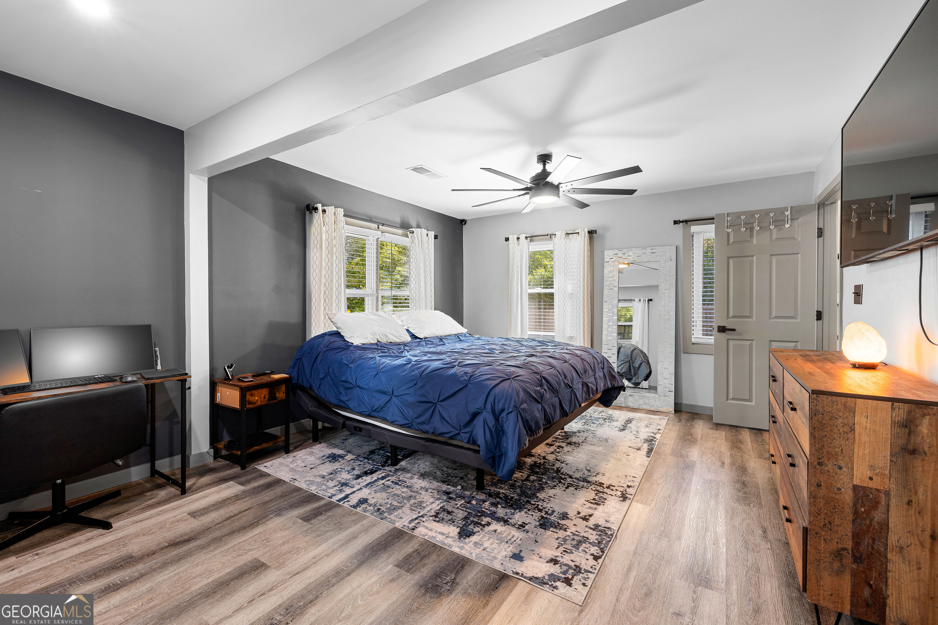 105 Ransby Drive Hogansville, GA 30230 - Photo 21 of 52 a spacious bedroom with a large bed a flat tv screen and dresser