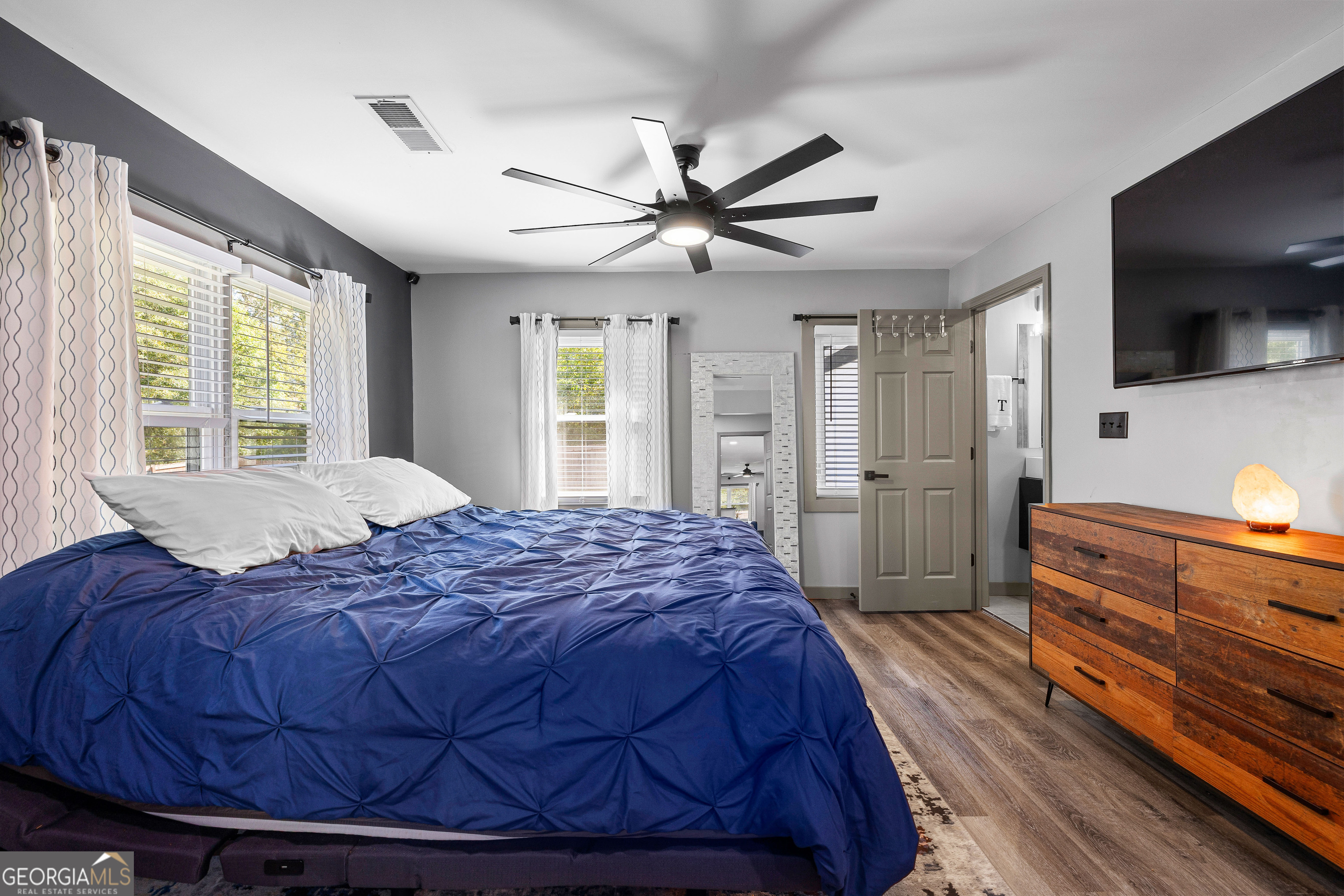 105 Ransby Drive Hogansville, GA 30230 - Photo 22 of 52 a spacious bedroom with a bed and a flat screen tv