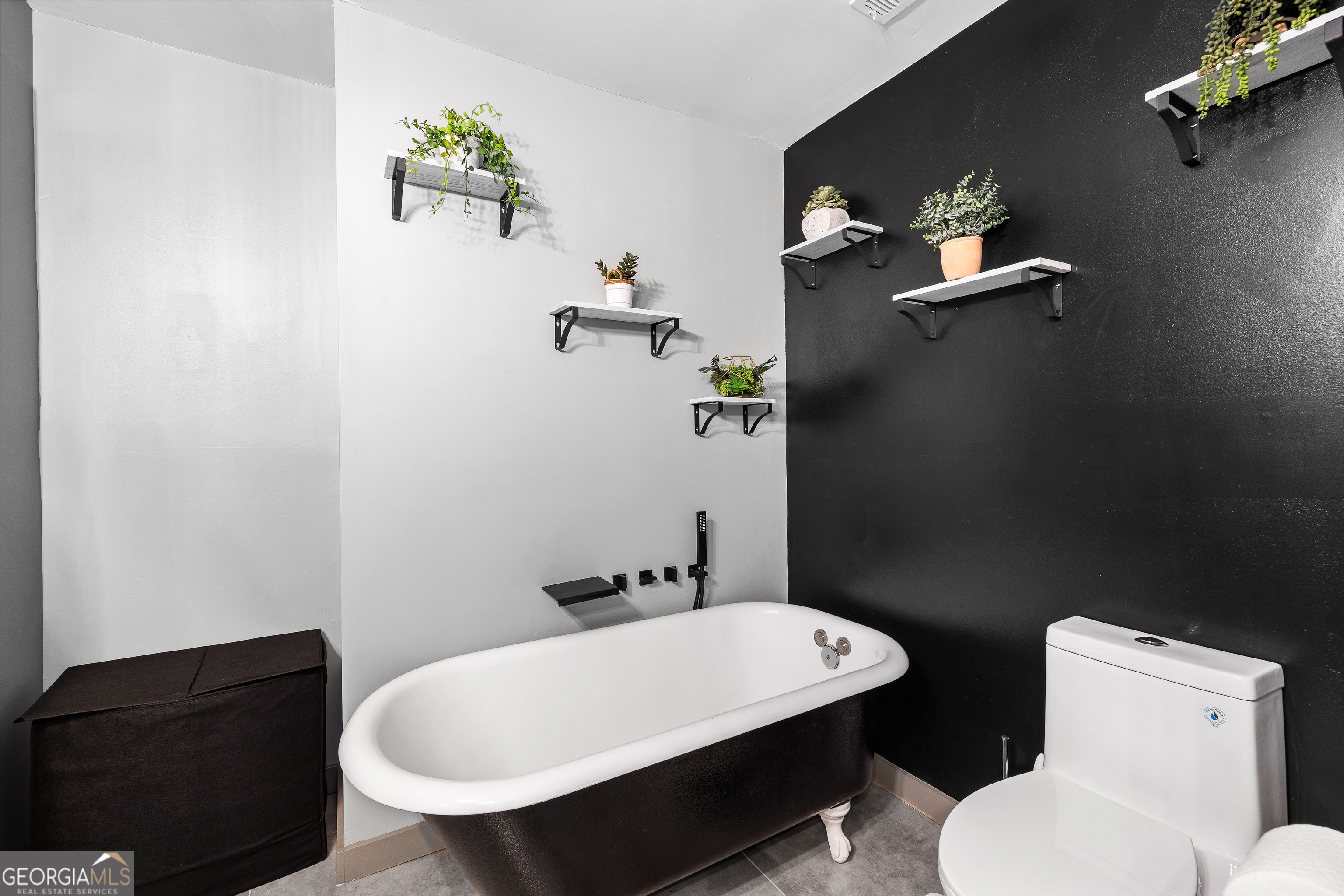 105 Ransby Drive Hogansville, GA 30230 - Photo 24 of 52 a bathroom with a toilet a sink and mirror