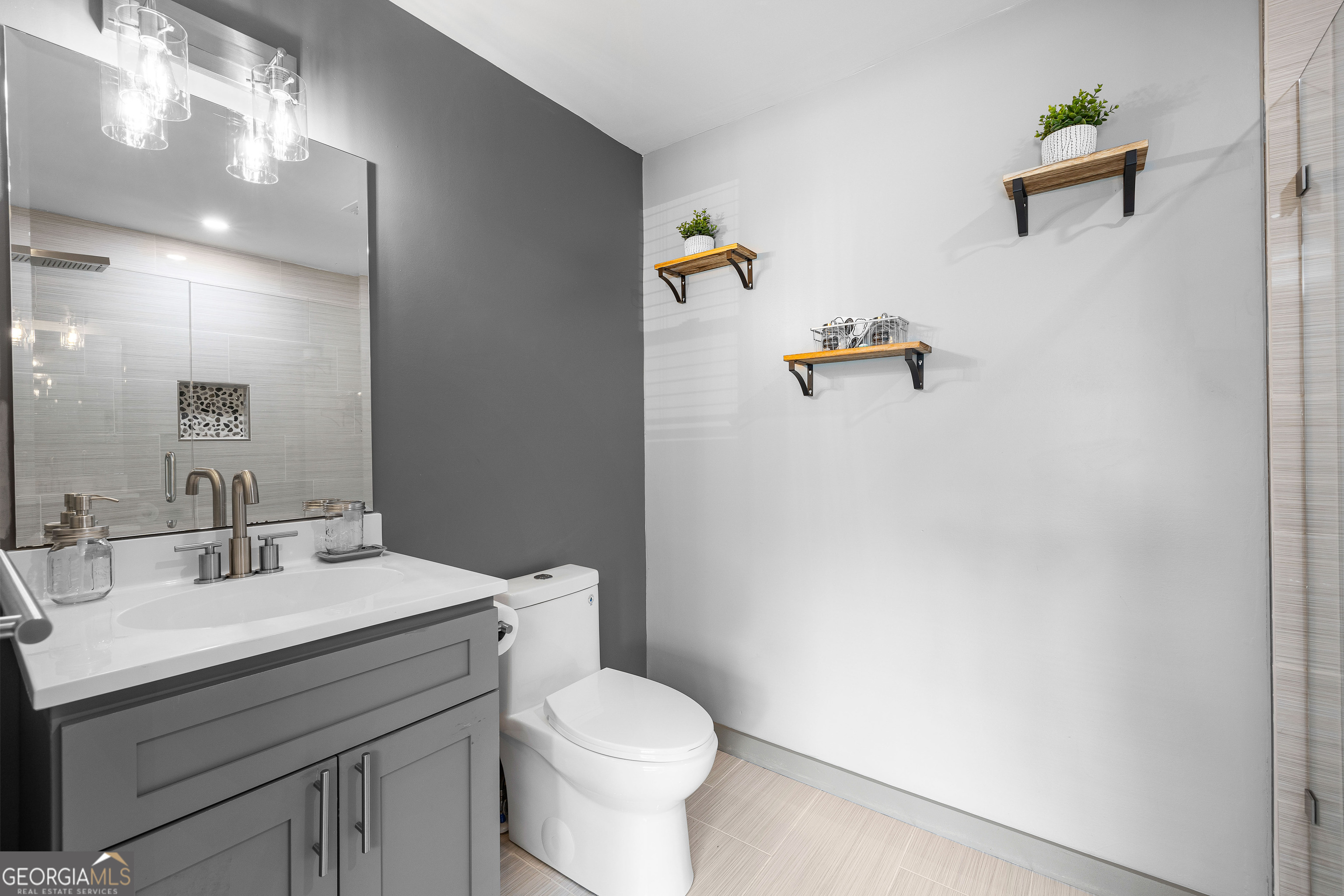 105 Ransby Drive Hogansville, GA 30230 - Photo 32 of 52 a bathroom with a sink mirror vanity and toilet