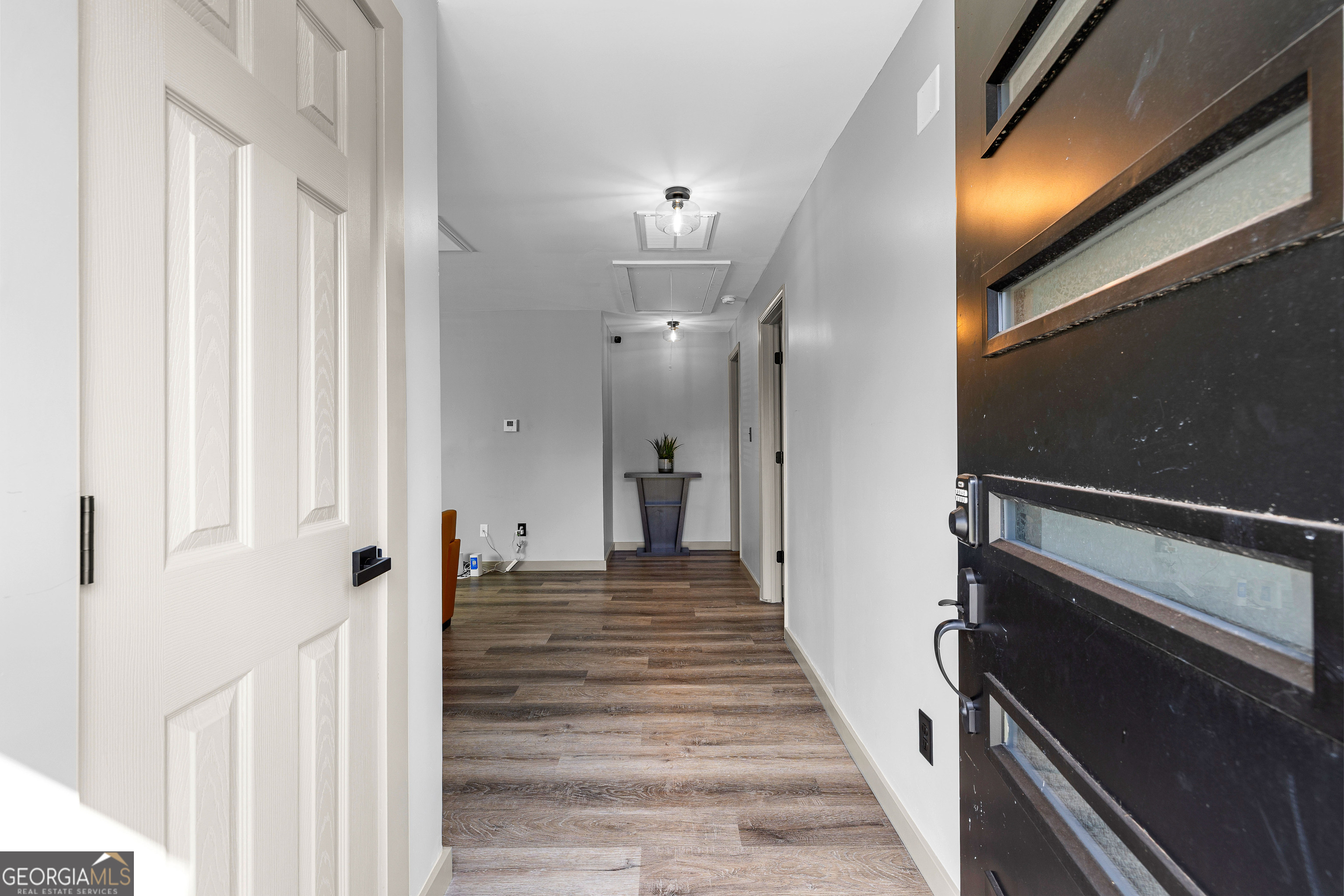 105 Ransby Drive Hogansville, GA 30230 - Photo 5 of 52 a view of a hallway with wooden floor and staircase