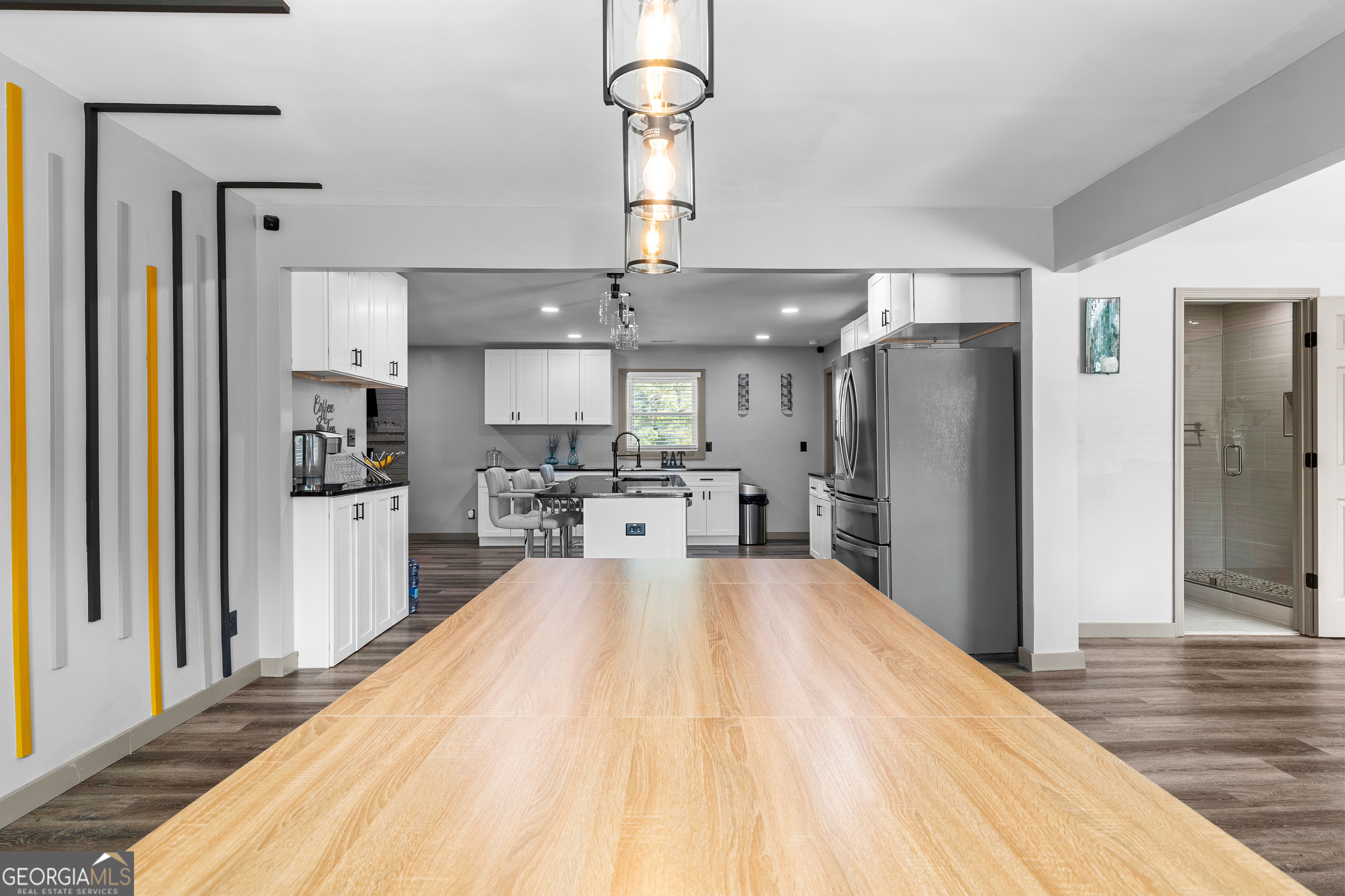 105 Ransby Drive Hogansville, GA 30230 - Photo 10 of 52 a large kitchen with stainless steel appliances a refrigerator and a wooden floor