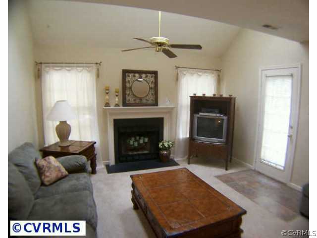 5802 Ridge Point Road Midlothian, VA 23112 - Photo 5 of 10 a living room with furniture and a fireplace