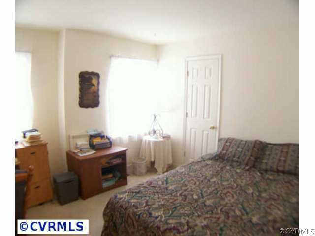 5802 Ridge Point Road Midlothian, VA 23112 - Photo 7 of 10 a bedroom with a bed and a closet