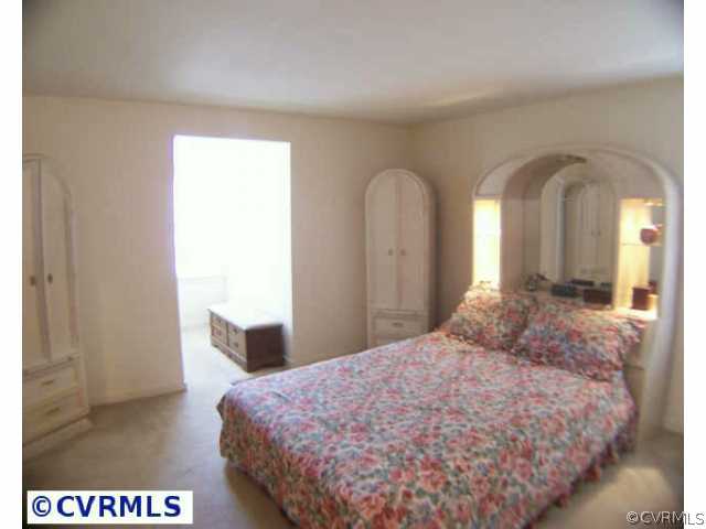 5802 Ridge Point Road Midlothian, VA 23112 - Photo 8 of 10 a bedroom with a bed and a dresser