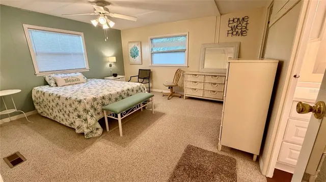 a bed room with a bed and a window