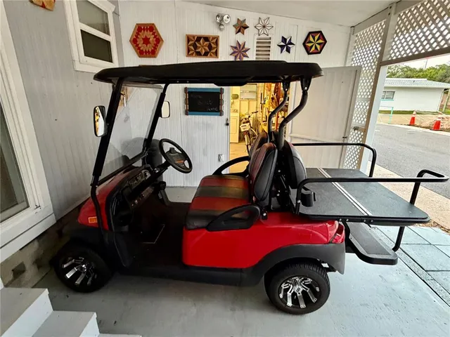 a car parked in a room next to a window