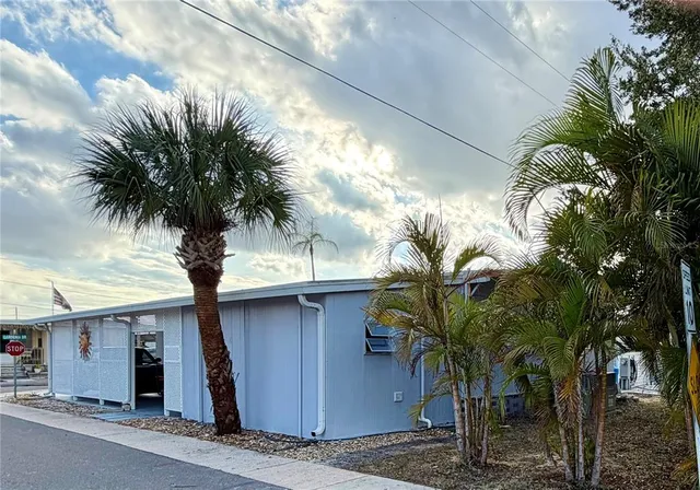 a backyard of a house with outdoor seating
