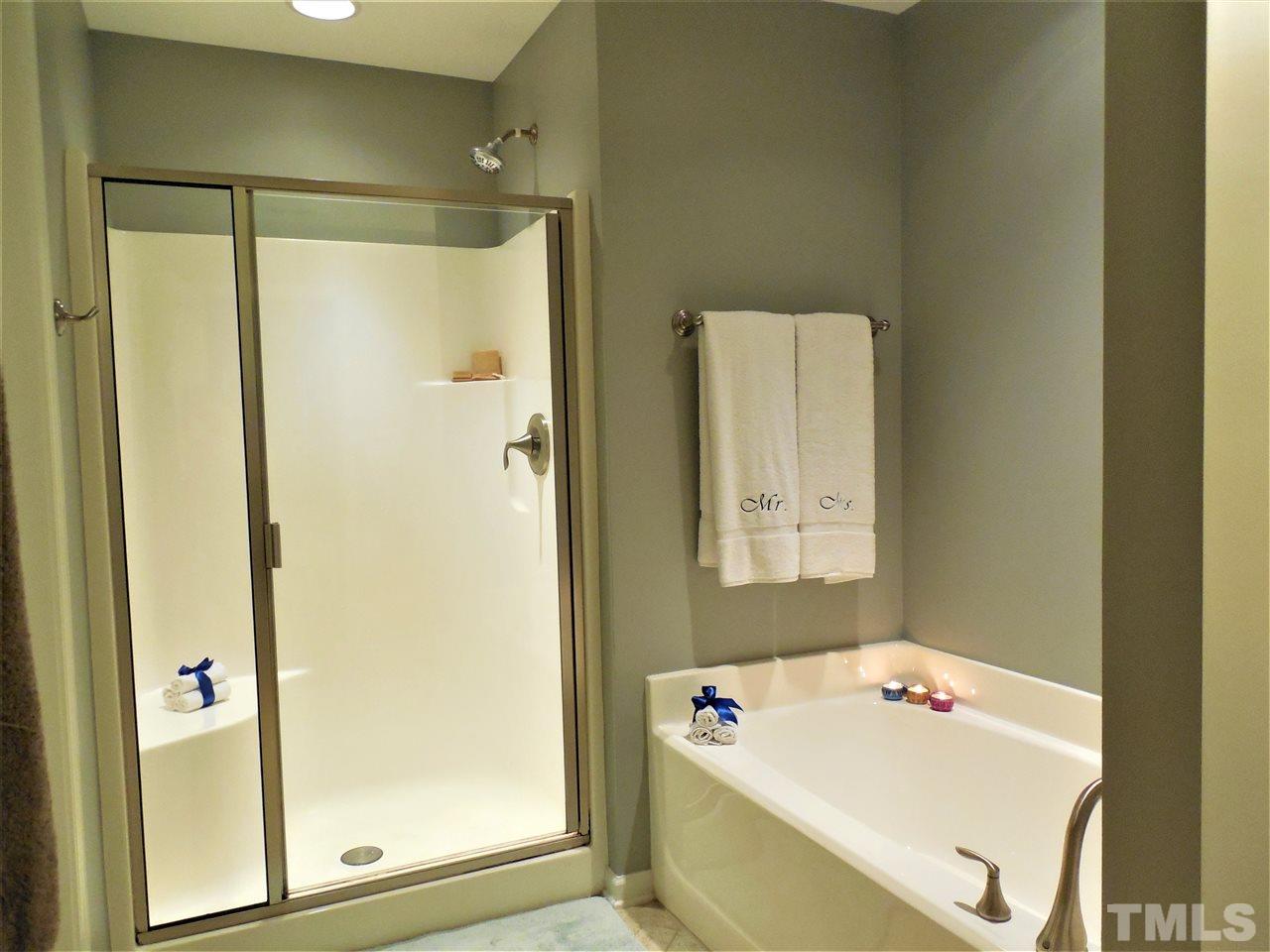 1235 Silver Beach Way Raleigh, NC 27606 - Photo 13 of 30 a bathroom with a tub and a shower