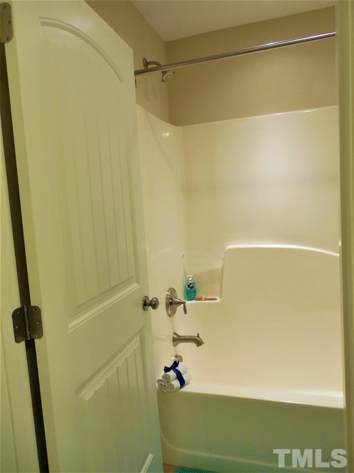 1235 Silver Beach Way Raleigh, NC 27606 - Photo 18 of 30 a bathroom with a shower and a bath tub