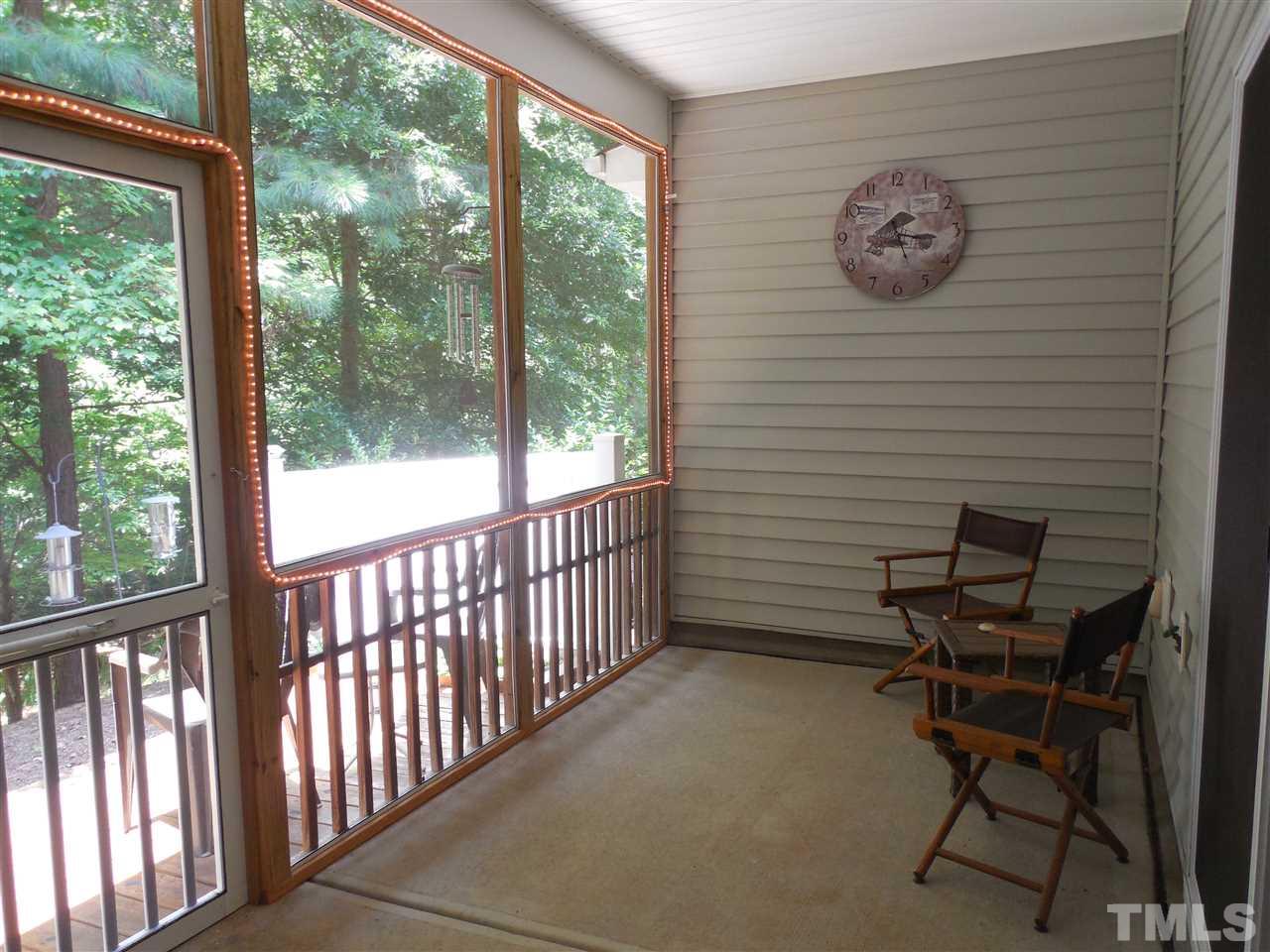 1235 Silver Beach Way Raleigh, NC 27606 - Photo 21 of 30 a view of a chair and table in a balcony