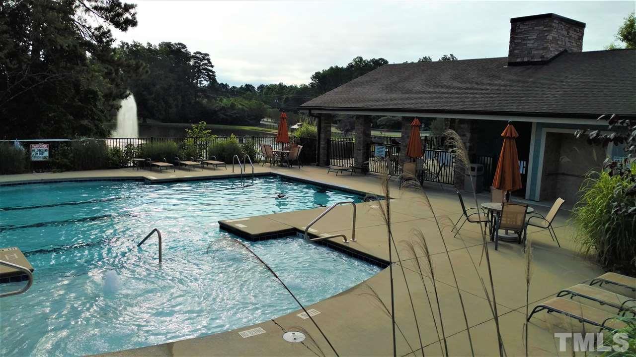 1235 Silver Beach Way Raleigh, NC 27606 - Photo 26 of 30 a view of a house with backyard water fountain and sitting area