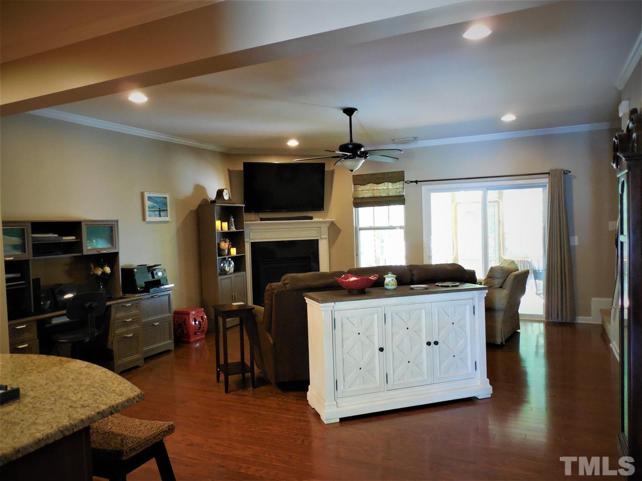 1235 Silver Beach Way Raleigh, NC 27606 - Photo 30 of 30 a kitchen that has a lot of cabinets in it and wooden floors