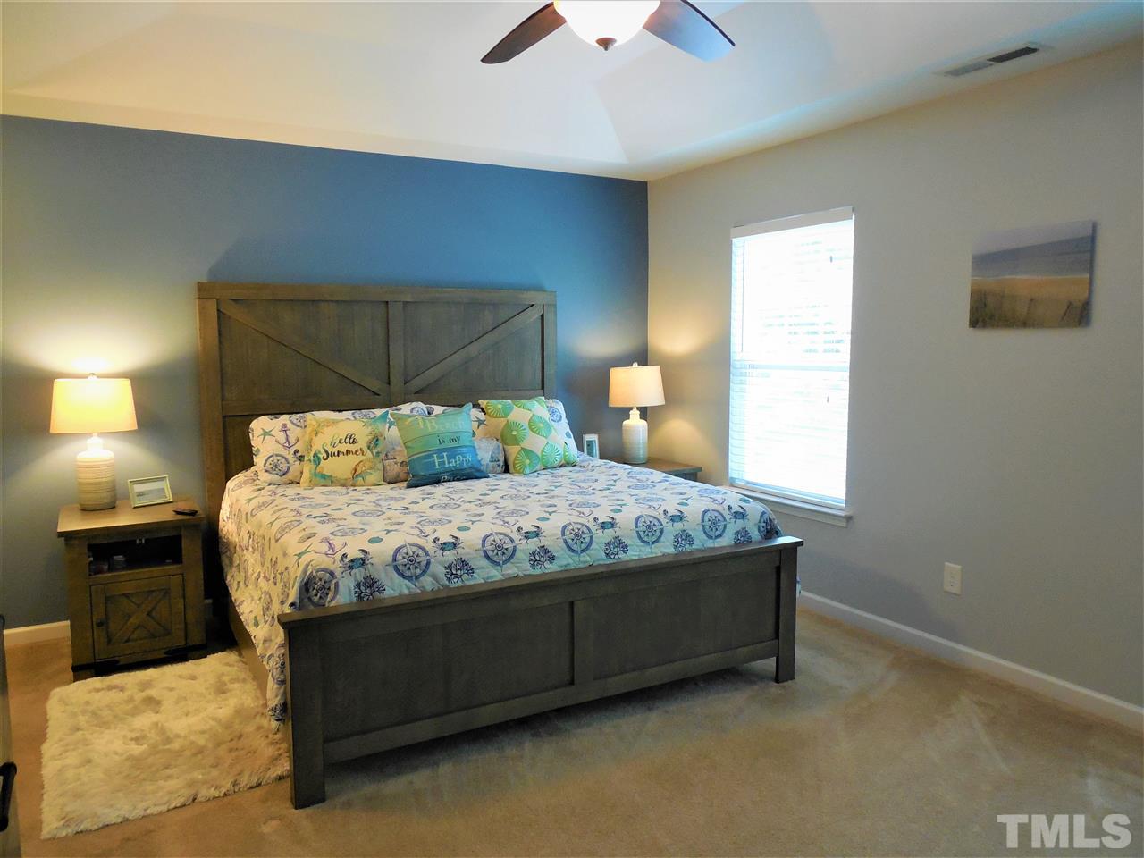 1235 Silver Beach Way Raleigh, NC 27606 - Photo 8 of 30 a bedroom with a bed and a window