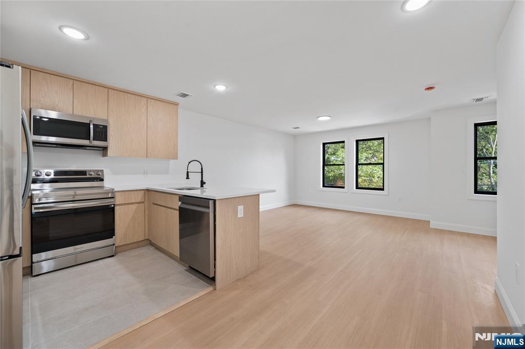 7 Montclair Avenue Paterson, NJ 07503 - Photo 14 of 26 a kitchen with a sink and a stove top oven