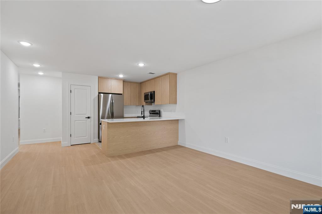 7 Montclair Avenue Paterson, NJ 07503 - Photo 2 of 26 a view of kitchen with wooden floor