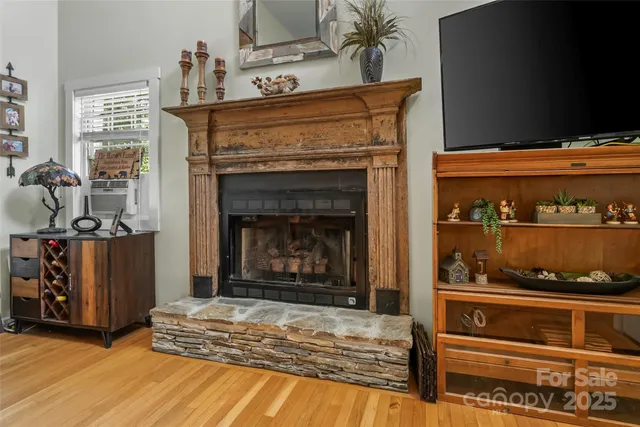 a kitchen with an oven and a fireplace