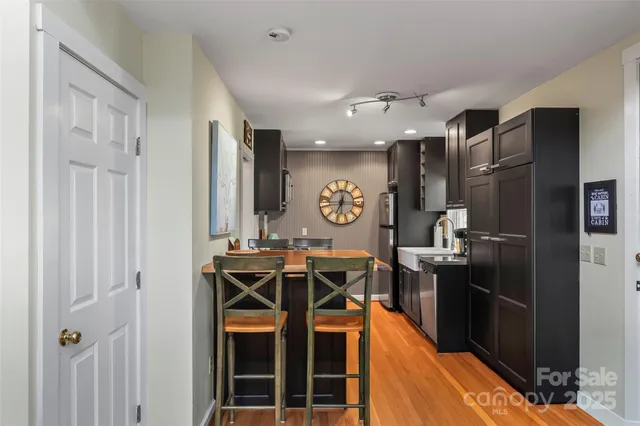 a kitchen with stainless steel appliances granite countertop a stove a refrigerator and a refrigerator