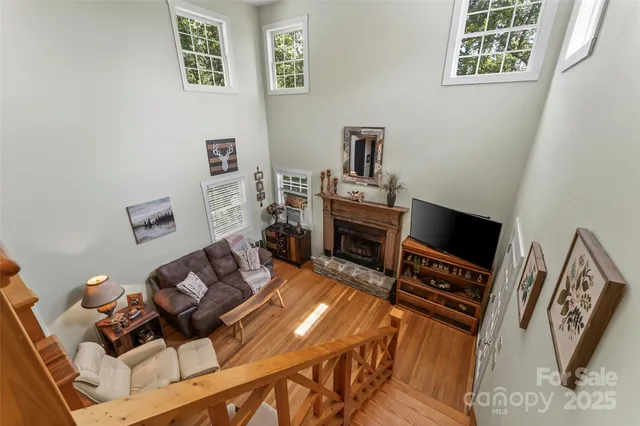 a living room with furniture rug and a fireplace
