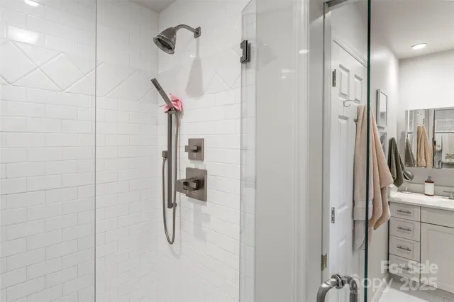a bathroom with a shower and a sink