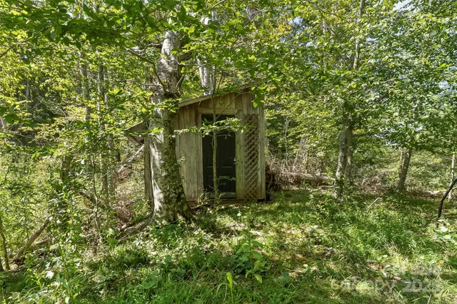 a view of a house with a tree